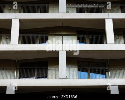 Modern facade of a residential building with balconies. Contrasty exterior of luxury apartments in the house. Symmetric view of the geometric shapes. Stock Photo