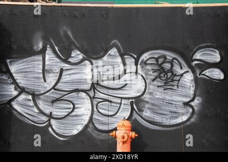 Graffiti tagged on a wall at the waterfront boardwalk in Halifax, Nova Scotia, Canada Stock Photo