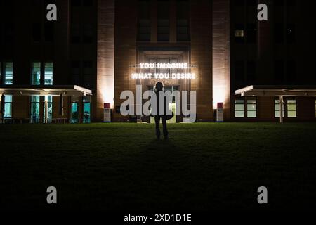 A long exposure of a person infront of a meaningful sign. Stock Photo