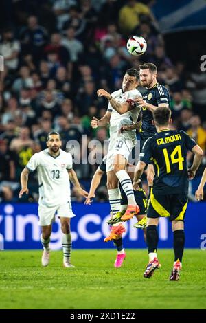 Cologne, Germany, June 19th 2024 COLOGNE, GERMANY - JUNE 19: Granit Xhaka of Switzerland and Anthony Ralston of Scotland compete for the ball during the UEFA Euro 2024 Championship Group A match between Scotland v Switzerland at Cologne Stadium on June 19, 2024 in Cologne, Germany. (Photo by Dan O' Connor/ATPImages) Dan O' Connor (Dan O' Connor / ATP Images / SPP) Stock Photo