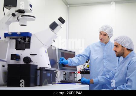 Watching polymeric nanofibers, images of Atomic Force Microscope, AFM  In the foreground the Axio Observer, Inverted microscope for fluorescence micro Stock Photo