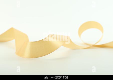 One beautiful light yellow ribbon isolated on white Stock Photo - Alamy