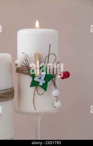 Four Advent candles calendar with Christmas zero waste decorations. Holiday preparation copy space for text. Catholic traditions of Christmas countdown new year winter holidays  Stock Photo