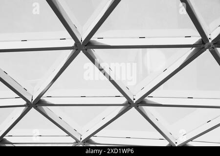 Close-up view of a geometric metal frame structure with intersecting lines and shapes. Black and white architecture pattern, construction, and modern Stock Photo