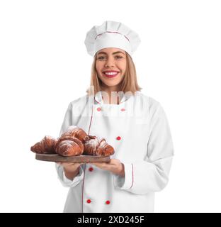 Female baker with board of tasty croissants on white background Stock Photo