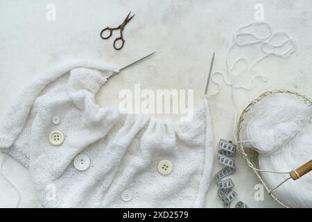 Knitting needles, yarn and measuring tape on white background Stock Photo