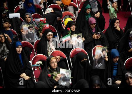 Tehran, Iran. 19th June, 2024. women hold posters of Saeed Jalili, the candidate for Iran's June 28 presidential election, and the late Iranian president Ebrahim Raisi during a campaign meeting of women supporting Saeed Jalili in Tehran, Iran, on June 19, 2024. (Photo by Sobhan Farajvan/Pacific Press) Credit: Pacific Press Media Production Corp./Alamy Live News Stock Photo