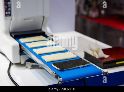 Japanese food Sashimi Sushi making machine. Sushi Rice Sheet Roll Makers Stock Photo