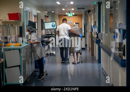 File photo dated 18/01/23 of a general view of staff on a NHS hospital ward at Ealing Hospital in London. The British Medical Association (BMA) said that with a week until walkouts begin in England, that Prime Minister Rishi Sunak 'only need make a commitment' in writing to a path to pay restoration that could be implemented should he form the next government. Issue date: Thursday June 20, 2024. Stock Photo