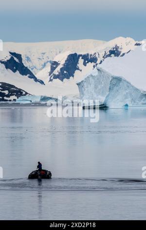 Danco Island, Antarctic Peninsula - January 31, 2024. Crew members of the Atarctic Exploration vessel Ocean Adventurer prepare zodiacs for explorations of Danco Island and its surroundings in the Antarctic Peninsula. Stock Photo