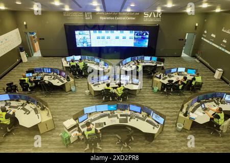 (240620) -- MECCA, June 20, 2024 (Xinhua) -- Staff members monitor the operation of the Al Mashaaer Al Mugaddassah Metro Line at the operation control center in Mecca, Saudi Arabia, June 19, 2024. The China Railway Construction Corporation (CRCC) on Wednesday announced that it has completed the 2024 Hajj operation of the Al Mashaaer Al Mugaddassah Metro Line in the city of Mecca in Saudi Arabia. Over the seven days, 2,206 trains have been dispatched, serving about 2.094 million passengers, CRCC said in a statement. TO GO WITH 'Chinese light rail delivers over 2 mln trips in Mecca for Hajj Stock Photo