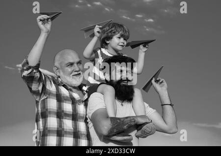 Fathers day. Family dream. Child dreams with plane. Grandfather father and child son dream. Daydreamers. Dreams and imagination. Dreamy son. Stock Photo