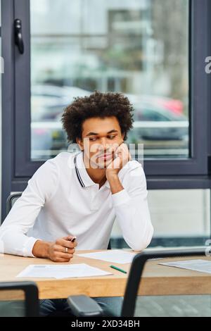Young man at desk, job interview. Stock Photo