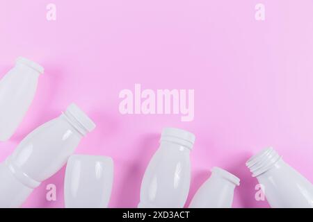 Top view of plastic bottles against a pink background Stock Photo