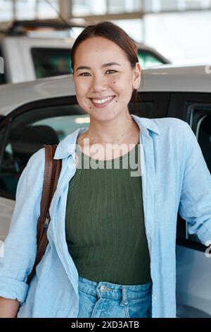 Portrait, new car and woman with smile, buying or excited with happiness, life goals or achievement. Face, person or client with purchase, vehicle or Stock Photo