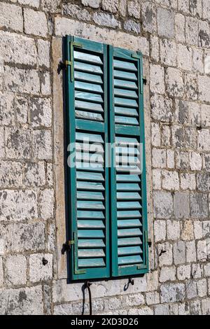 Green window shutters in Kotor, Montenegro Stock Photo