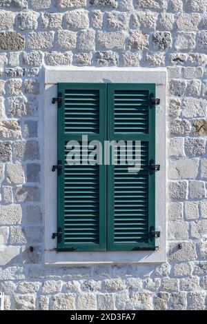 Green window shutters in Kotor, Montenegro Stock Photo