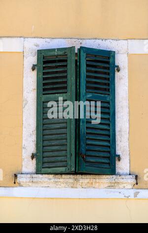 Green window shutters in Kotor, Montenegro Stock Photo