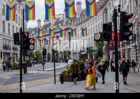 Intersex Inclusive Pride flags high above Regent Street in advance of the Pride in London parade on 9th June 2024 in London, United Kingdom. The flag includes stripes to represent LGBTQ+ communities, with colors from the Transgender Pride Flag, alongside the and circle of the Intersex flag. Stock Photo