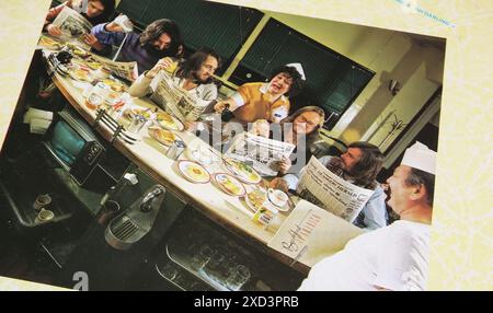 Viersen, Germany - May 9. 2024: Vinyl record album back cover Breakfast in America from 1979 with Supertramp band foto sitting in american diner Stock Photo