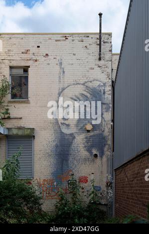 Banksy Mural, The girl with the pierced eardrum (2014), Bristol, Great Britain Stock Photo