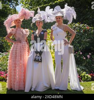 Ascot, Berkshire, UK. 20th June, 2024. Three elegantly dressed young ladies pose for the cameras. Racegoers on Ladies Day (Day 3) of Royal Ascot. Dapper gentlemen in formal attire and ladies, often in dresses and elaborate hat creations can be seen arriving and mingling before going to the races. Credit: Imageplotter/Alamy Live News Stock Photo