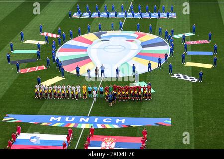 Munich, Germany. 20th June, 2024. Soccer: European Championship, Slovenia - Serbia, preliminary round, group C, match day 2, Munich Football Arena, the teams before kick-off. Credit: Daniel Karmann/dpa/Alamy Live News Stock Photo