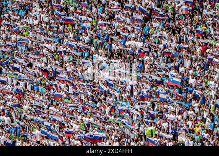 Munich, Germany. 20th June, 2024. Soccer: European Championship, Slovenia - Serbia, preliminary round, group C, match day 2, Munich Football Arena, Slovenia fans in the stands. Credit: Daniel Karmann/dpa/Alamy Live News Stock Photo