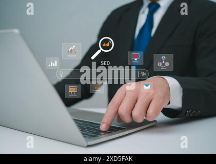 Businessman use search engine to Searching for information, Market research on virtual screen, Data search technology, Search engine optimization, Usi Stock Photo