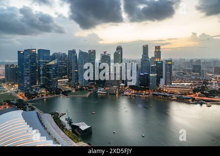 Singapore - February 19, 2017: Awesome aerial view of Marina Bay and skyscrapers of downtown at sunset. Amazing Singapore skyline. Stock Photo