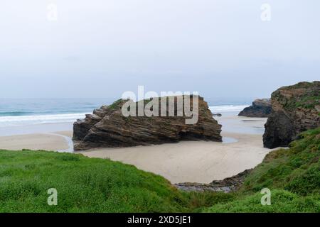 Majestic view of the Playa de las Catedrales in Ribadeo, Spain. A natural wonder showcasing unique arches and a tranquil coastline Stock Photo