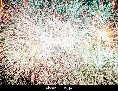 composite closeup photo of fireworks in black night sky Stock Photo