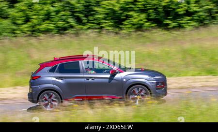 Milton Keynes,UK - June 20th 2024: 2019 grey Hyundai Kona  car driving on a British country road Stock Photo