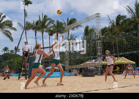 Womens beach volley ball in action.  Players attacking, ball in view Stock Photo