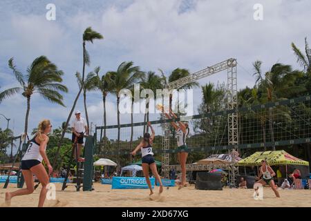 Womens beach volley ball in action.  Players attacking, ball in view Stock Photo