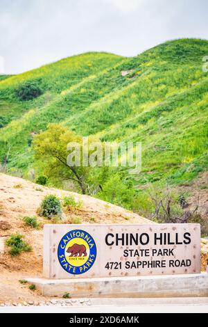 Sign in front of green hills at Chino HIlls State Park in California. Stock Photo