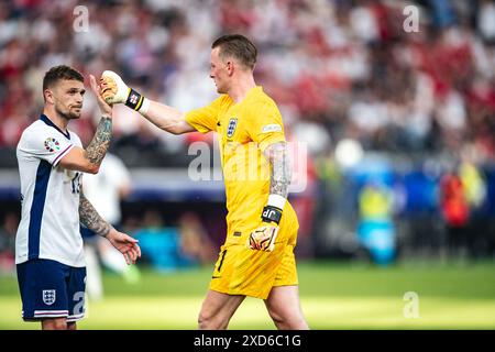 Frankfurt, Germany. 20th June, 2024. Frankfurt, Germany, June 20th 2024 FRANKFURT, GERMANY - JUNE 20: Kieran Trippier of England and Jordan Pickford of England seen during the UEFA Euro 2024 Championship Group C match between Denmark and England at Frankfurt Arena on June 20, 2024 in Frankfurt, Germany. (Photo by Dan O' Connor/ATPImages) Dan O' Connor (Dan O' Connor/ATP Images/SPP) Credit: SPP Sport Press Photo. /Alamy Live News Stock Photo