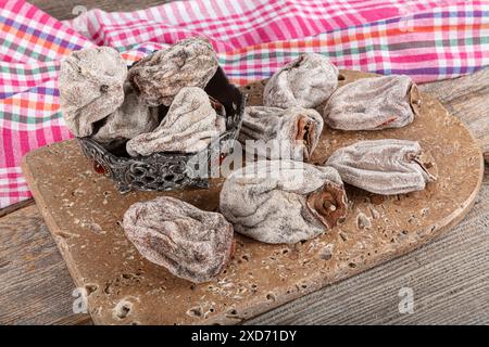 Sweet appetizing healthy persimmon dried. Dried persimmon fruit sold by the herbalist. Known name in Turkish: Cennet Hurmasi. Stock Photo