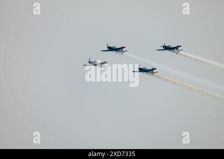 Performing Fighter Planes Flying in Formation Stock Photo
