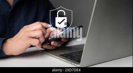 Cybersecurity and privacy concepts to protect data. Businessman use smartphone with cyber security technology for protecting personal data and secure Stock Photo