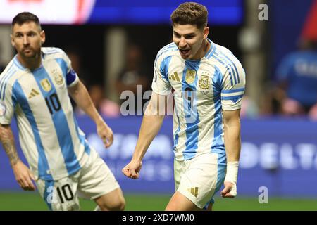 Argentina's forward Julian Alvarez (R) celebrates with his teammate forward Lionel Messi after scoring the team’s first goal against Canada during the Copa America USA 2024, group A, groupe stage match between Argentina and Canada, at Mercedes Benz stadium in Atlanta, on June 20, 2024. Stock Photo