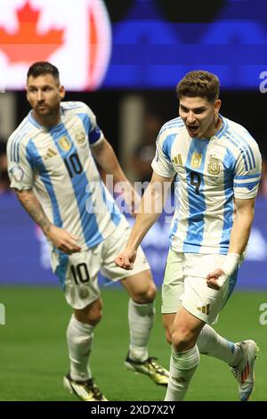 Argentina's forward Julian Alvarez (R) celebrates with his teammate forward Lionel Messi after scoring the team’s first goal against Canada during the Copa America USA 2024, group A, groupe stage match between Argentina and Canada, at Mercedes Benz stadium in Atlanta, on June 20, 2024. Stock Photo