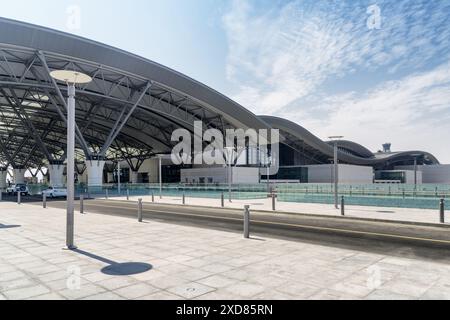 View of Muscat International Airport in Oman on blue sky background. Departure hall of Terminal 1. Stock Photo