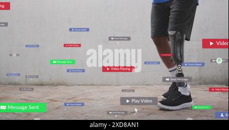 Image of notification bars over african american man with prosthetic leg standing on path Stock Photo