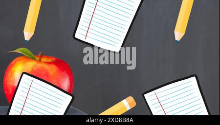 Image of school icons, apple and copy space over black background Stock Photo