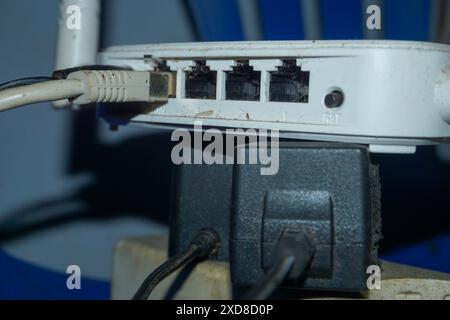 Someone stuck the plug in the socket. someone plugged the phone charger into a wall outlet. High quality photos Stock Photo