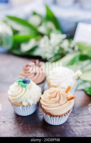 Assorted cupcakes with various frosting and decorative toppings Stock Photo