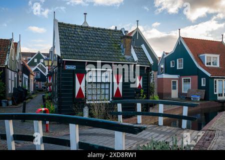 Volendam street with traditional dutch houses and a canal Stock Photo