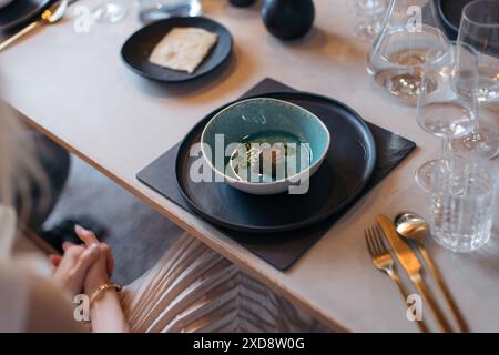 Elegant table setting with gourmet appetizer and glassware Stock Photo