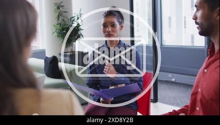Image of email icon and data processing over diverse business people in office Stock Photo